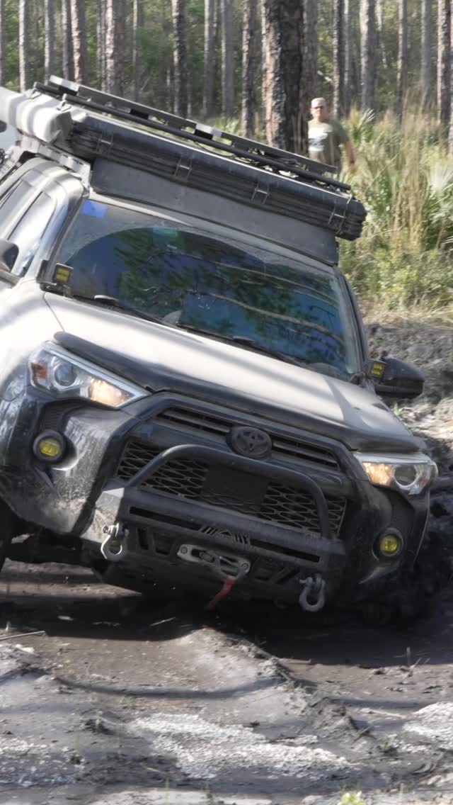 4Runner flexing over roots and rock